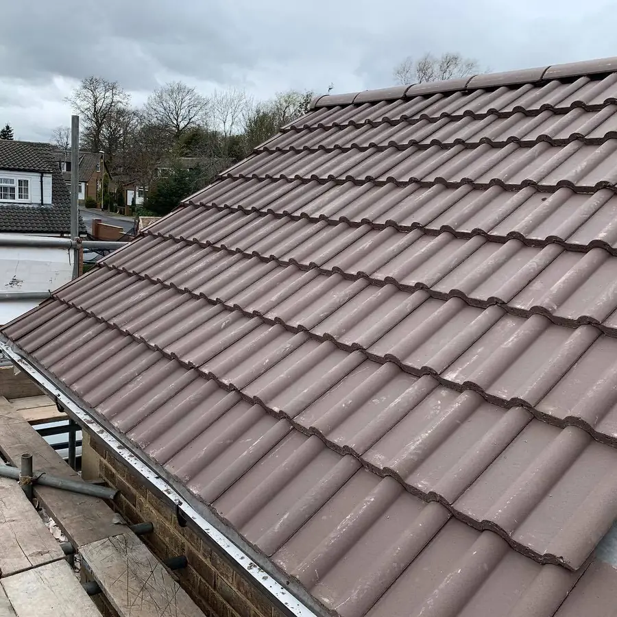 Brown double roman style tiles on a finished roof slope
