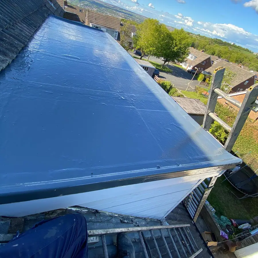 Glossy grey GRP fibreglass flat roof with trims, fresh from the topcoat